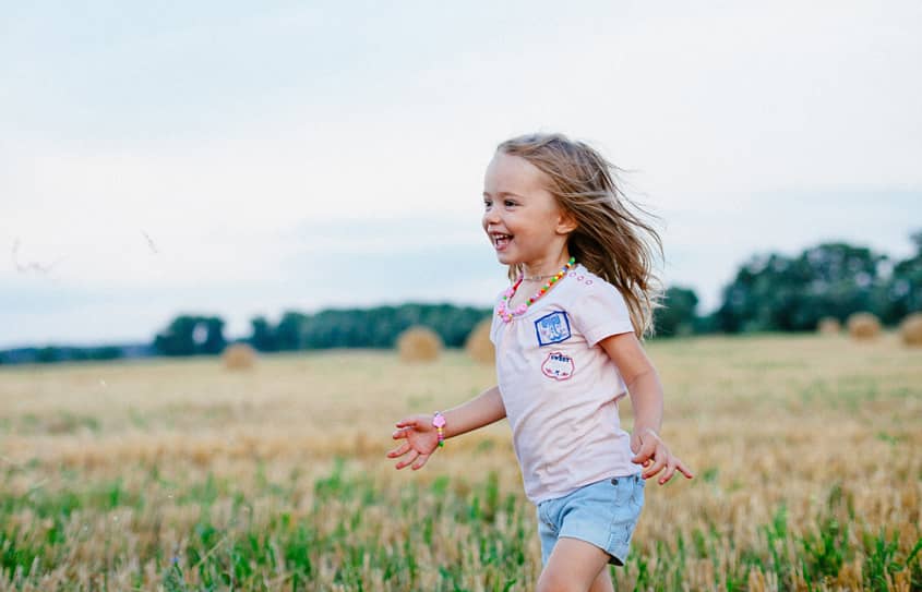 A carefree child, too busy having fun to feel tired